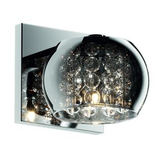Kinkiet CRYSTAL W0076-01A-B5FZ    Transparentne kryształy w połączeniu ze szkłem barwionym na ciemno zapewniają niepowtarzalną iluminację. Nowoczesna...