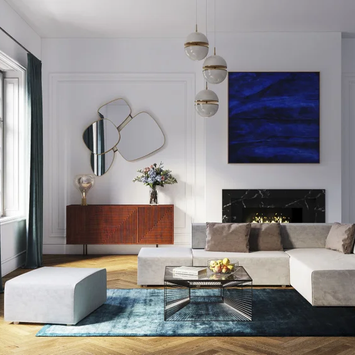 Szara sofa modułowa w dużym salonie