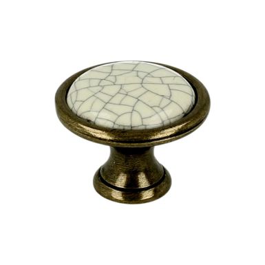 Gałka ROMANA 1700 - stary mosiądz, jasnobeżowa popękana porcelana / fi 29 mm  Wymiary:- średnica: 29 mm - wysokość: 21,5 mm  Materiał:  - metal -...