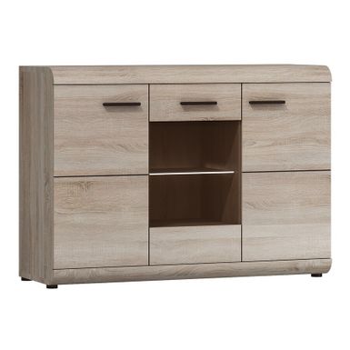 Komoda 3-drzwiowa LINK E - dąb sonoma Ta 3-drzwiowa komoda to mebel, który nie tylko ułatwia organizację przestrzeni, ale także wprowadza do niej ciepło i...