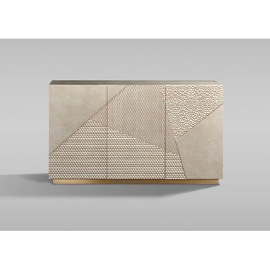Oryginalna komoda w kolorze szampańskiego złota. Prosty design przełamany jest frontem ze zróżnicowaną strukturą 3D i geometrycznym, asymetrycznym...