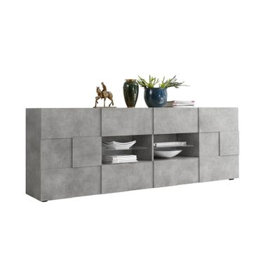 Komoda do salonu DAMA beton 241 cm posiada dwie pojemne szafki po bokach oraz dwie szuflady po środku mebla. Pomiędzy szufladami umieszczona jest szklana...