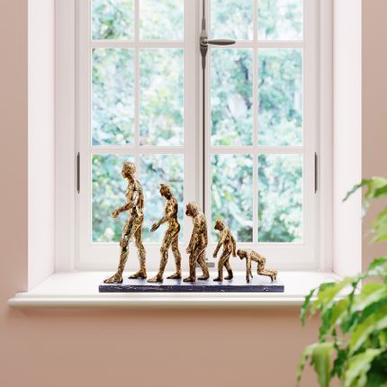 figurka_dekoracyjna_zlota_ewolucja_58x19_cm_8104316851.jpg