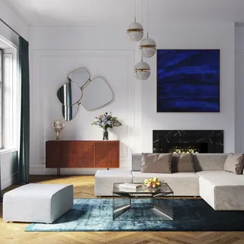 Szara sofa modułowa w dużym salonie